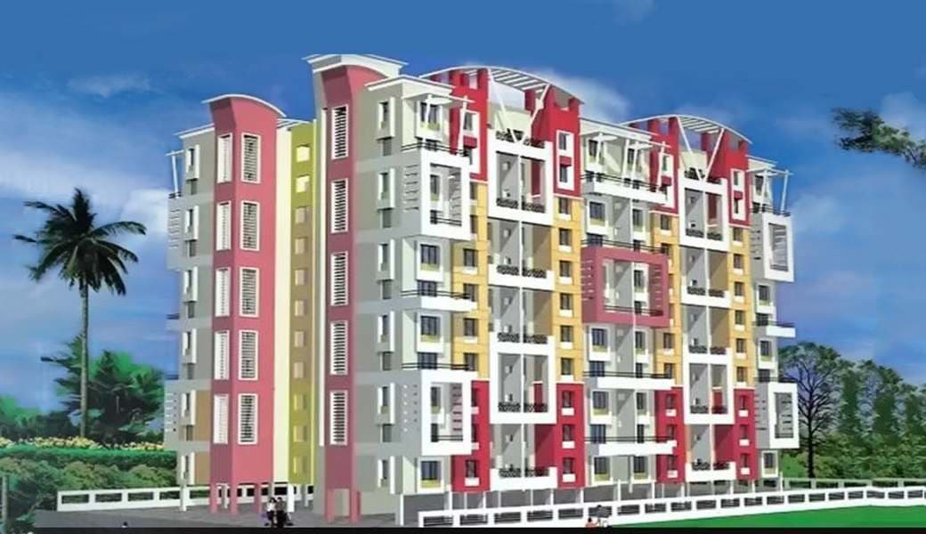 Sahil Heights, a colourful mid-rise apartment building framed by palms