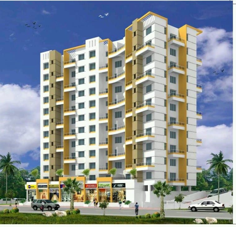 Sahil Om Park, a yellow and white apartment tower with ground-floor shops