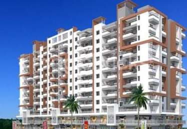 Vaishnavi Ouranos, a tall white apartment tower with balconied elevations